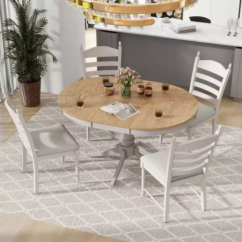 Tavolo da pranzo con piano rotondo allungabile e 4 sedie imbottite