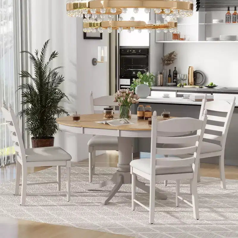 Tavolo da pranzo con piano rotondo allungabile e 4 sedie imbottite