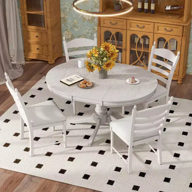 Tavolo da pranzo con piano rotondo allungabile e 4 sedie imbottite